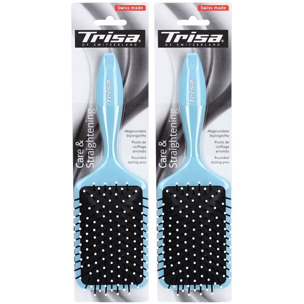 Deux brosses à cheveux plates bleues claires avec coussinets noirs. Marque Trisa. Emballage "Swiss made".