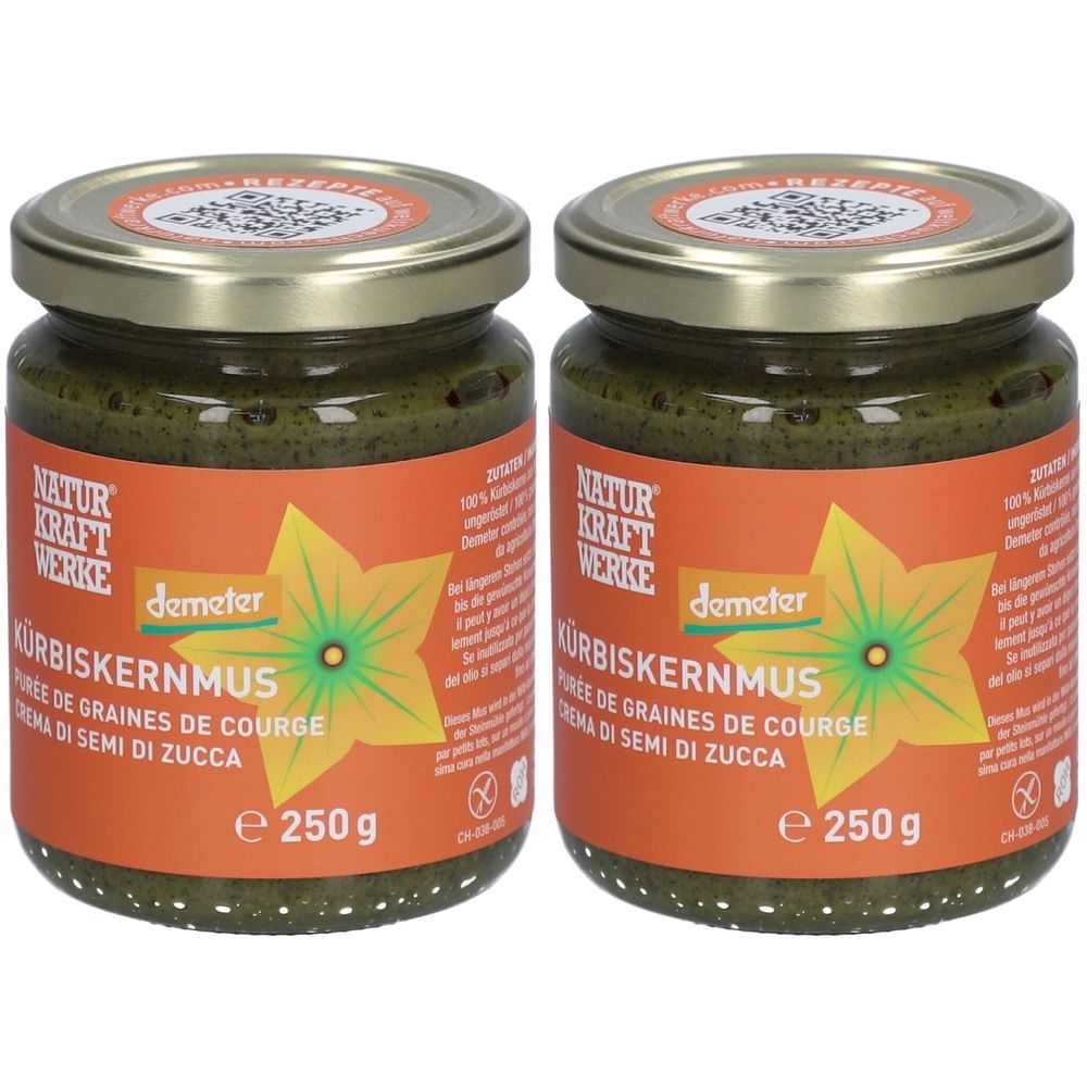 Deux pots de purée de graines de courge. Étiquettes avec NATURKRAFTWERKE, demeter, KÜRBISKERNMUS, 250g. Contenu vert, couvercle doré.