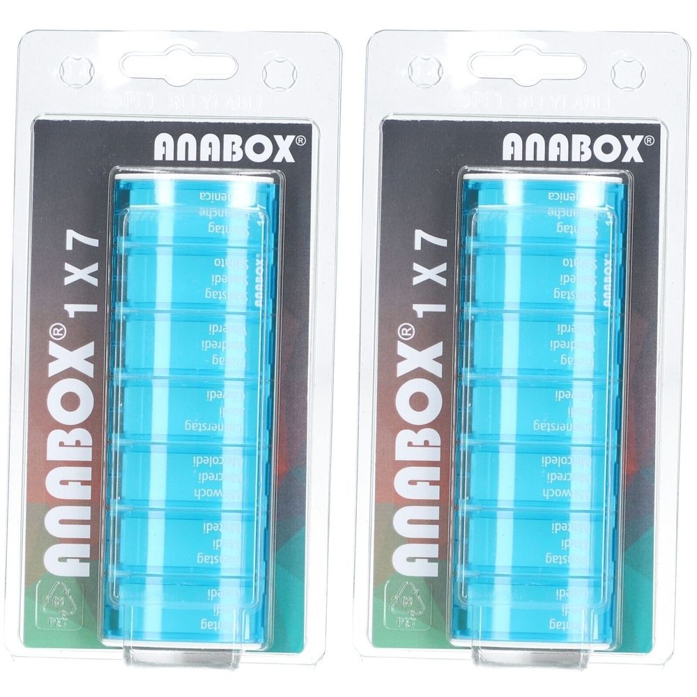 Deux piluliers sous blister. Distributeurs rectangulaires turquoise à sept compartiments. Inscription "ANABOX 1x7".