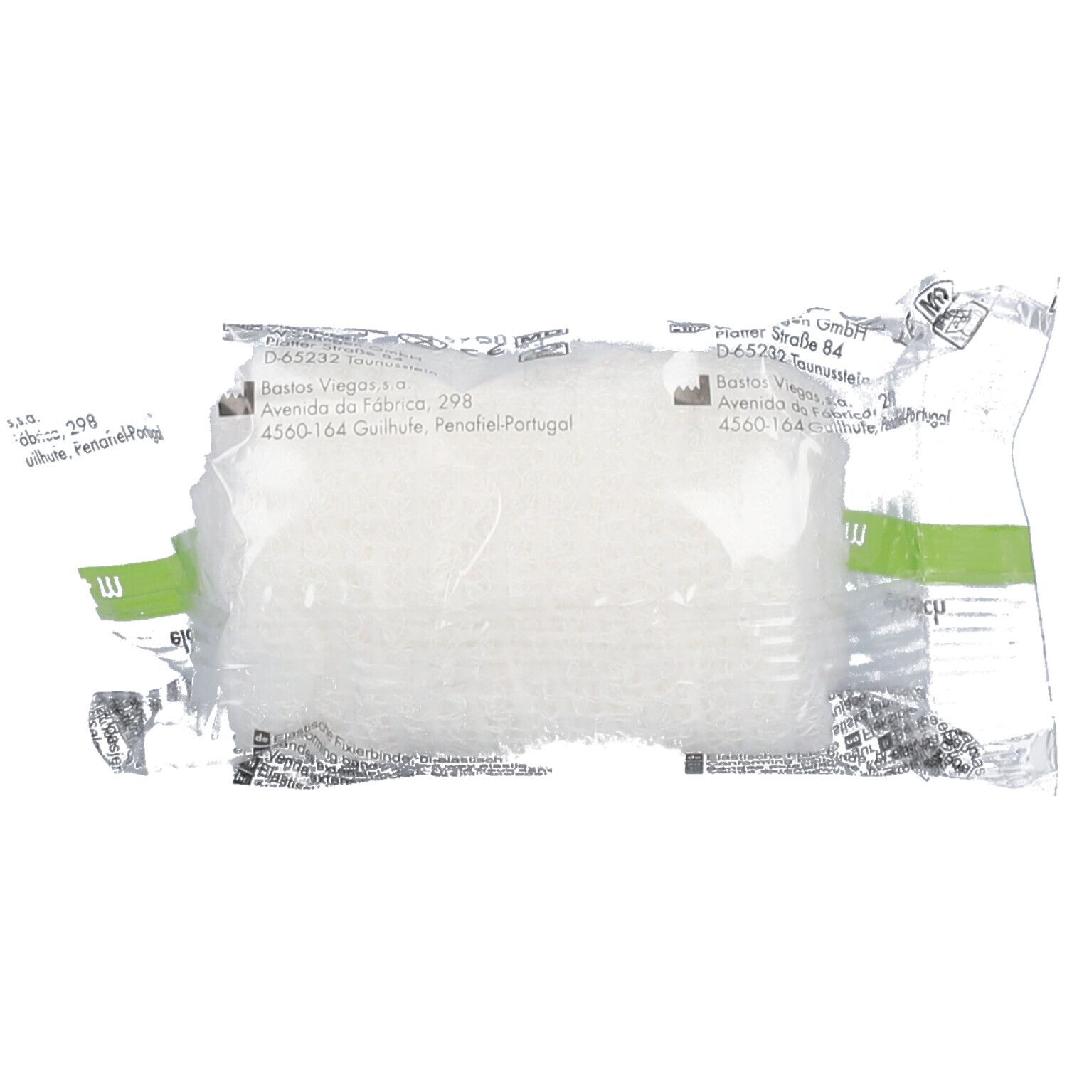 Bande élastique sous emballage plastique. Bande blanche visible à travers l'emballage transparent. Emballage vert et blanc.