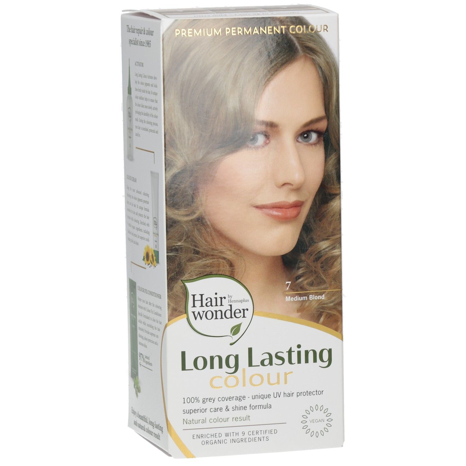 Emballage de teinture capillaire avec photo de modèle, inscription "Long Lasting Colour 7 Medium Blond".