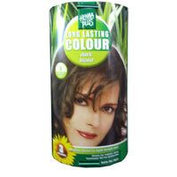 Emballage cylindrique avec visage de femme et nom du produit. Design vert et jaune. Inscription : Long Lasting Colour, Dunkelblond.