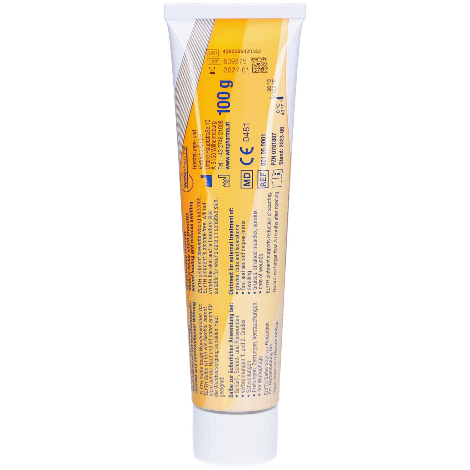 Dos d'un tube de crème. Texte en plusieurs langues. Fond jaune et blanc. Marquage CE.