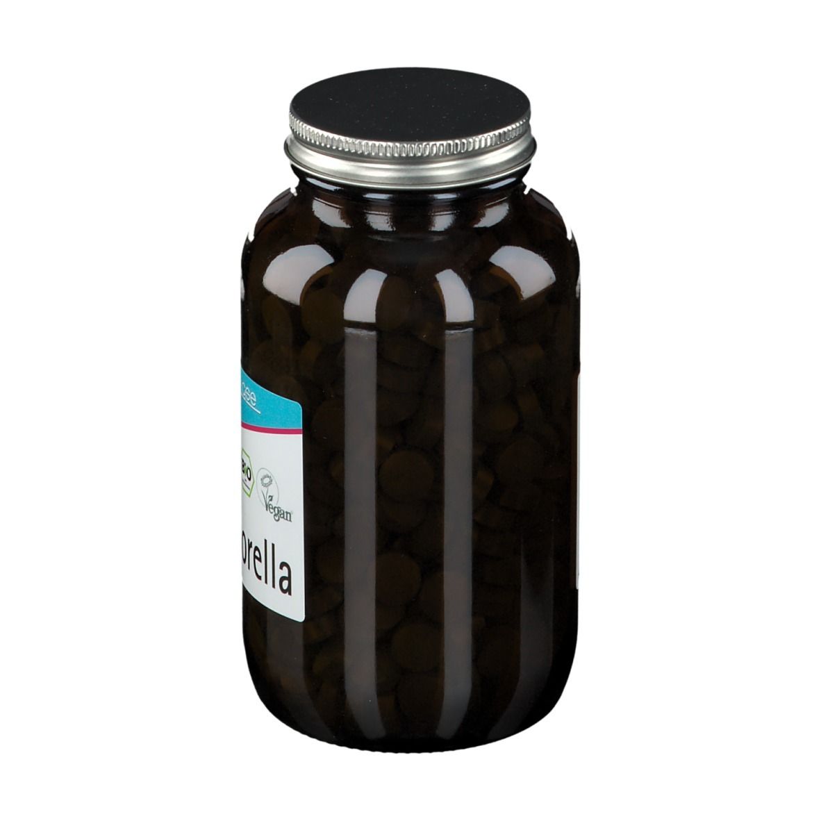 Flacon en verre brun avec comprimés noirs. Étiquette "BIO Chlorella". Bouchon noir. Vue latérale.