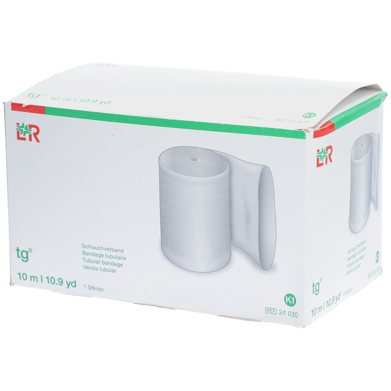 tg® Bandage tubulaire en emballage. Bande blanche, 10 m. Inscriptions : tg®, 10 m | 10.9 yd, K1.