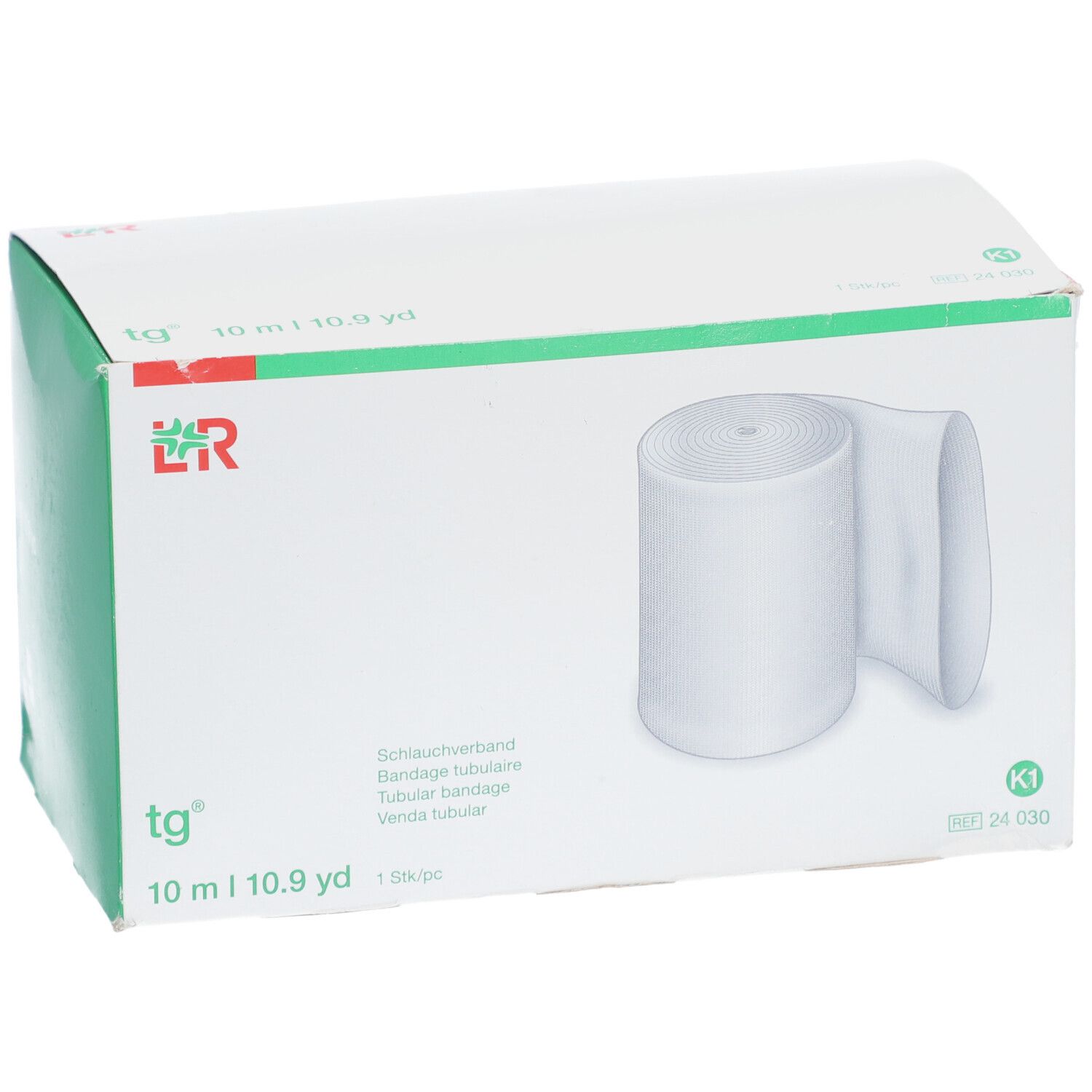 tg® Bandage tubulaire en emballage. Bande blanche, 10 m. Inscriptions : tg®, 10 m | 10.9 yd, K1.