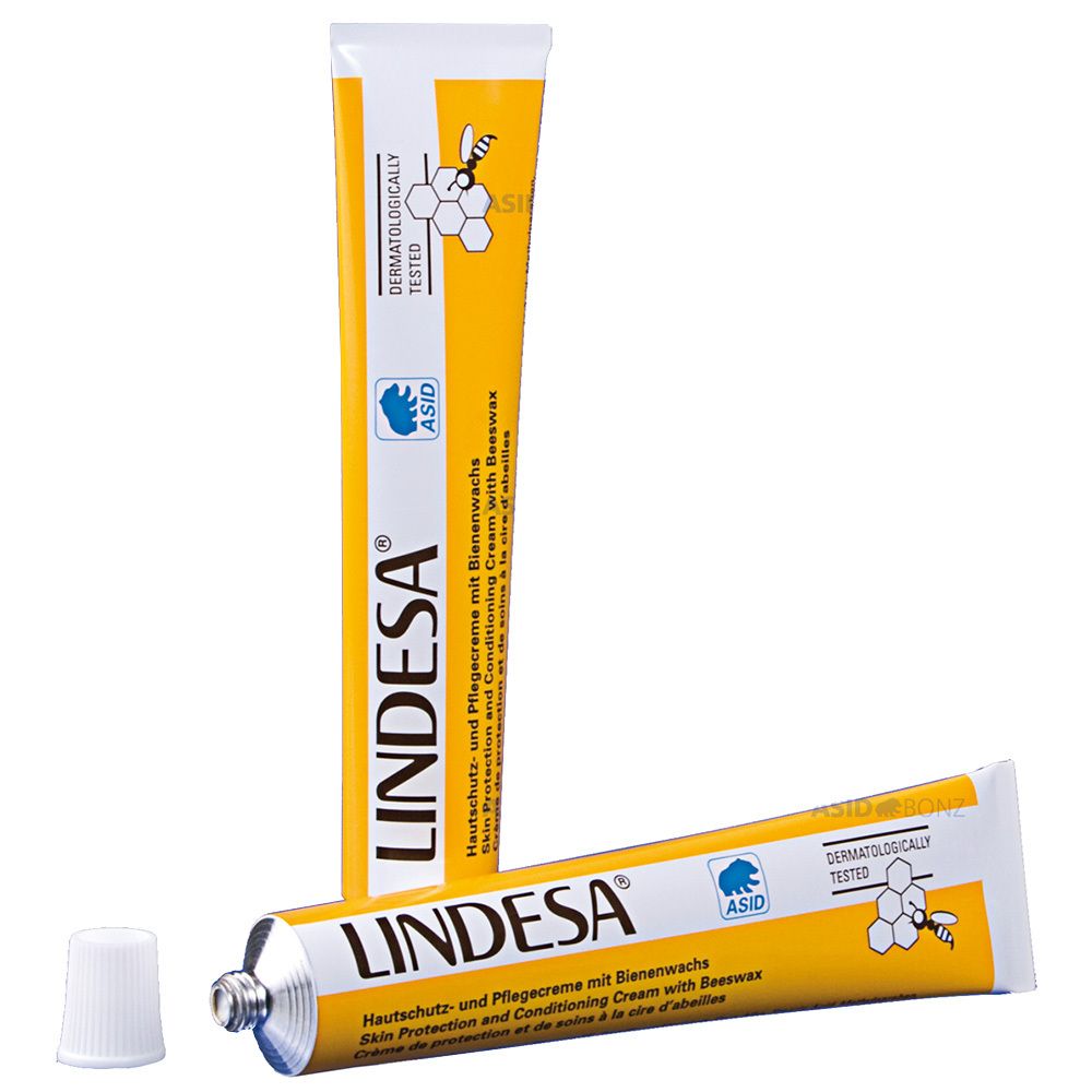 Tube jaune avec bouchon blanc. Inscription LINDESA. Crème protectrice et de soin à la cire d'abeille. Testé dermatologiquement.