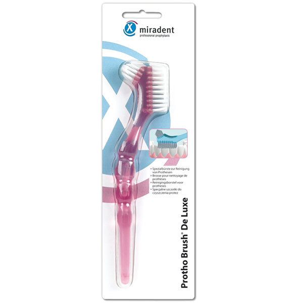 Protho Brush® De Luxe rose en emballage blister. Tête de brosse avec poils blancs. Logo Miradent en haut.