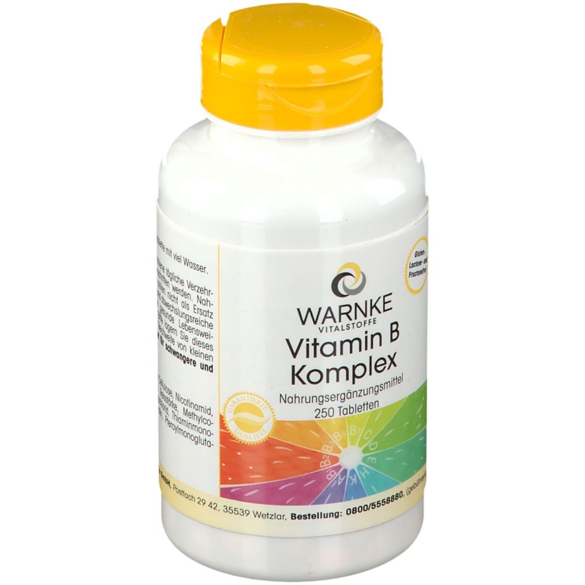 Flacon blanc à bouchon jaune. Inscription: WARNKE Vitamin B Komplex, 250 comprimés. Arc-en-ciel coloré.