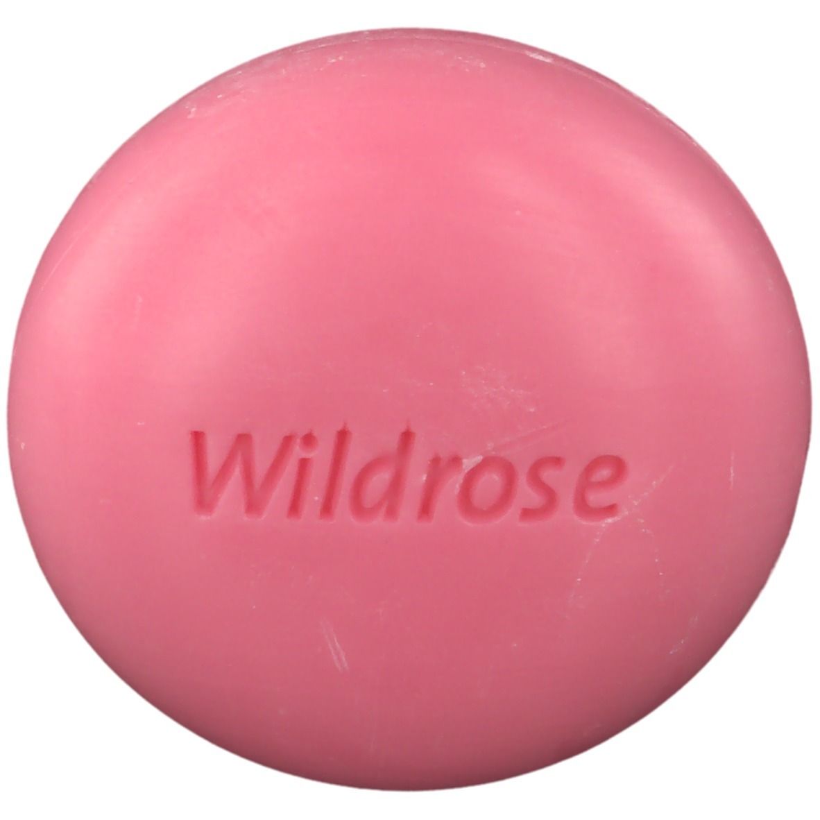 Savon rose rond avec inscription "Wildrose".