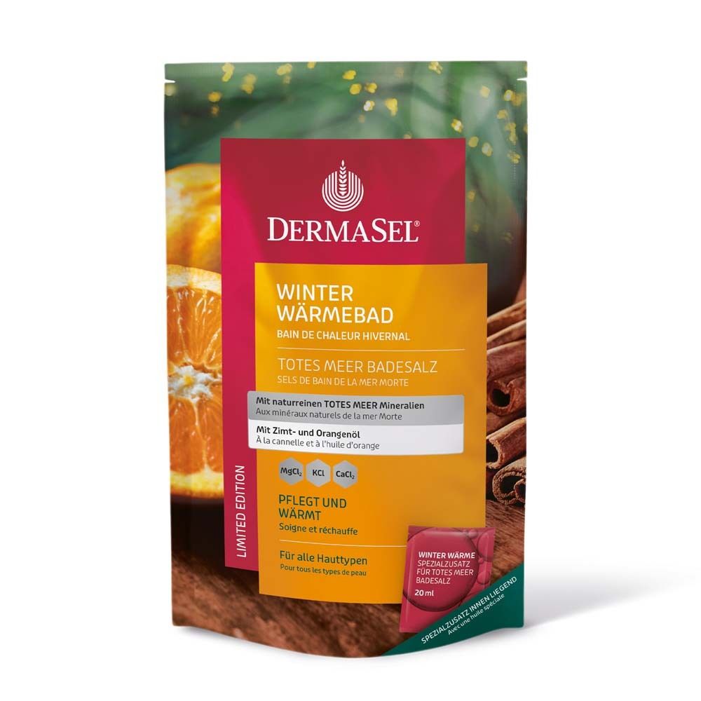 Emballage DermaSel Bain de Chaleur Hivernal. Couleurs principales : rouge, jaune, vert. Contient du sel de bain. Avec huile de cannelle et d'orange. Édition limitée.