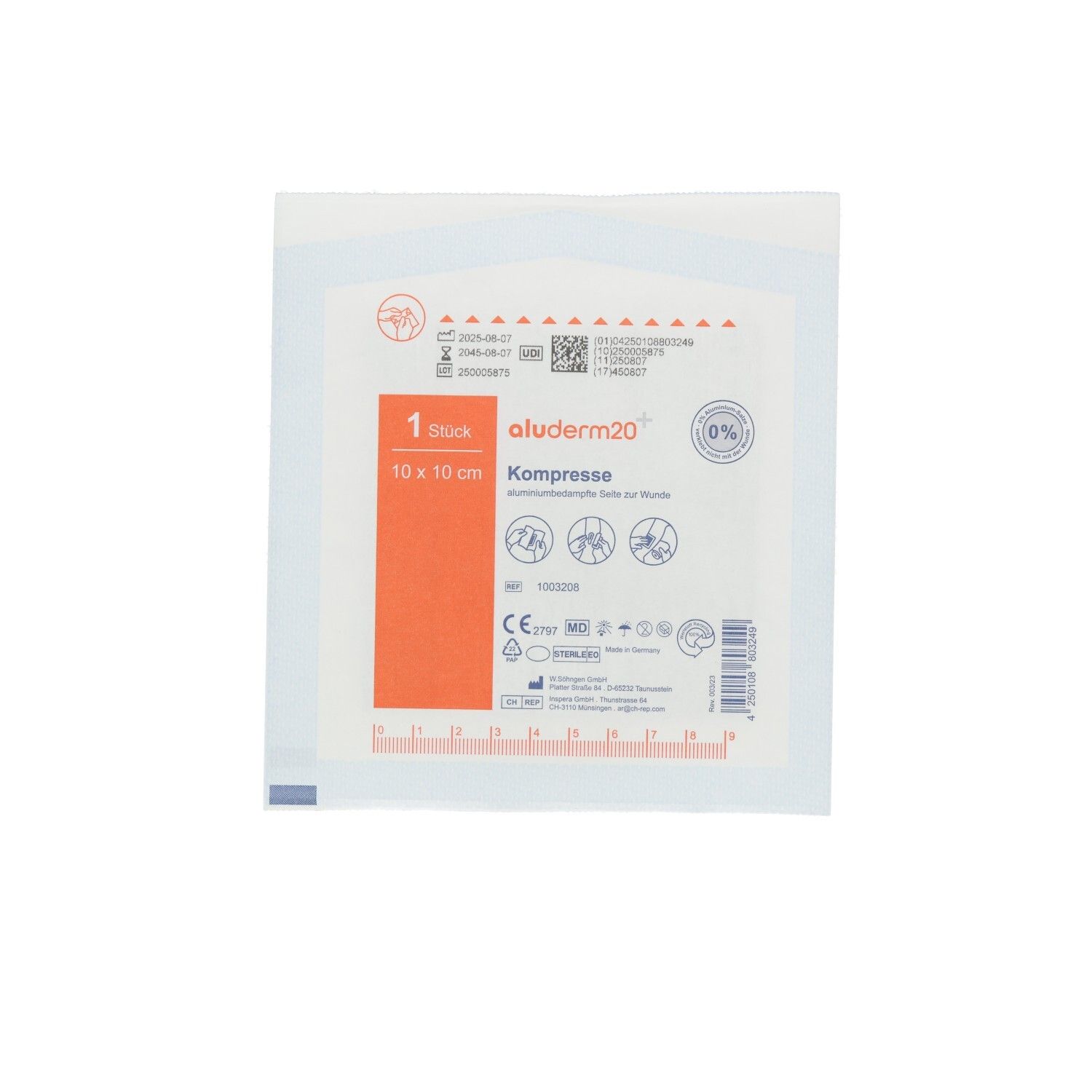Emballage de compresse. Texte: aluderm20+ Kompresse, 10 x 10 cm. 1 pièce. Emballage stérile avec certifications et pictogrammes.