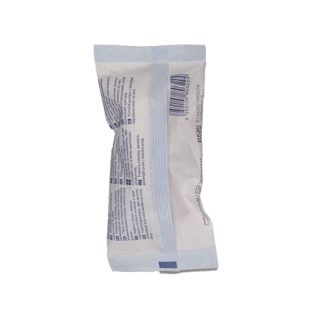 Dos de la compresse. Emballage blanc avec texte et code-barres. Accents bleus sur les bords.