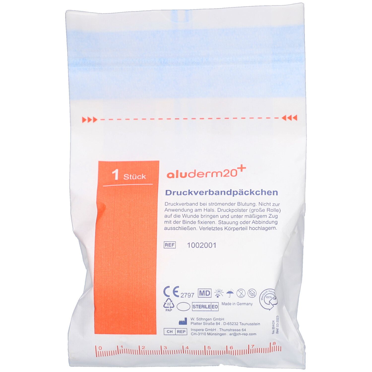 Paquet de pansement compressif blanc. Zone de texte orange avec informations produit. Logo stérile.