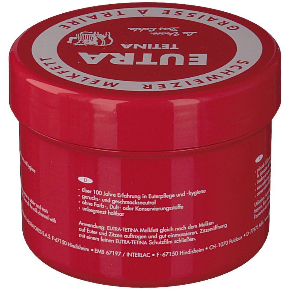 Pot rouge avec couvercle blanc. Inscription : Eutra Tetina, Melkfett suisse, Graisse à Traire. Texte en allemand.