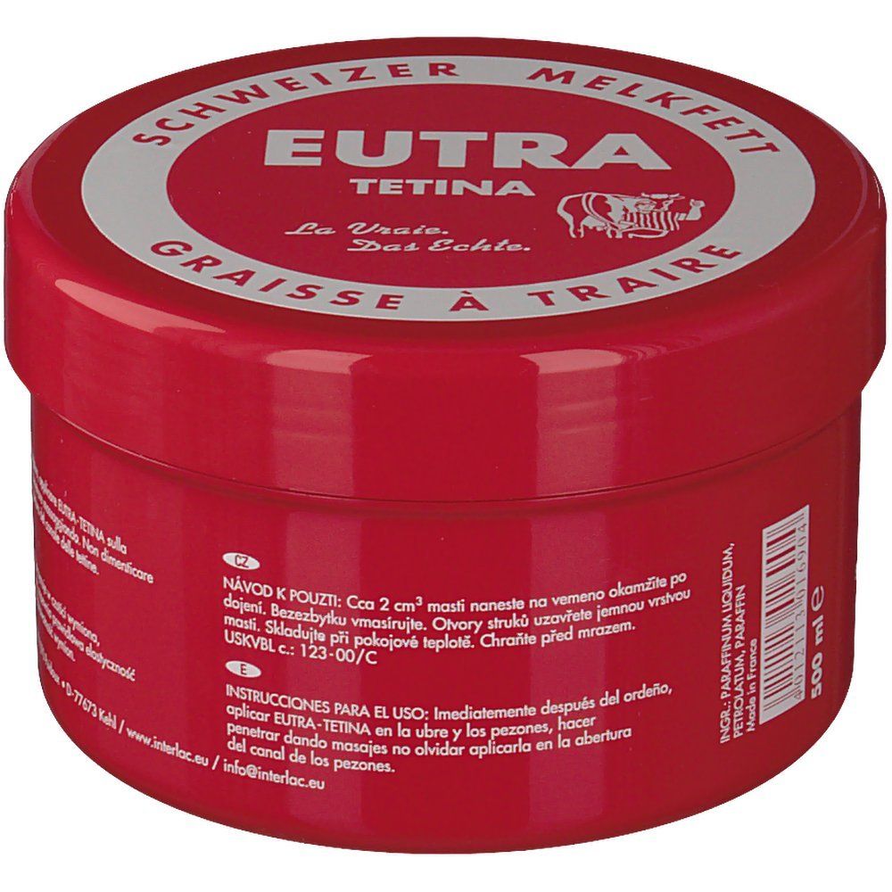 Pot rouge avec couvercle blanc. Inscription: Eutra Tetina, Schweizer Melkfett, Graisse à Traire. Symbole de vache. 500 ml.