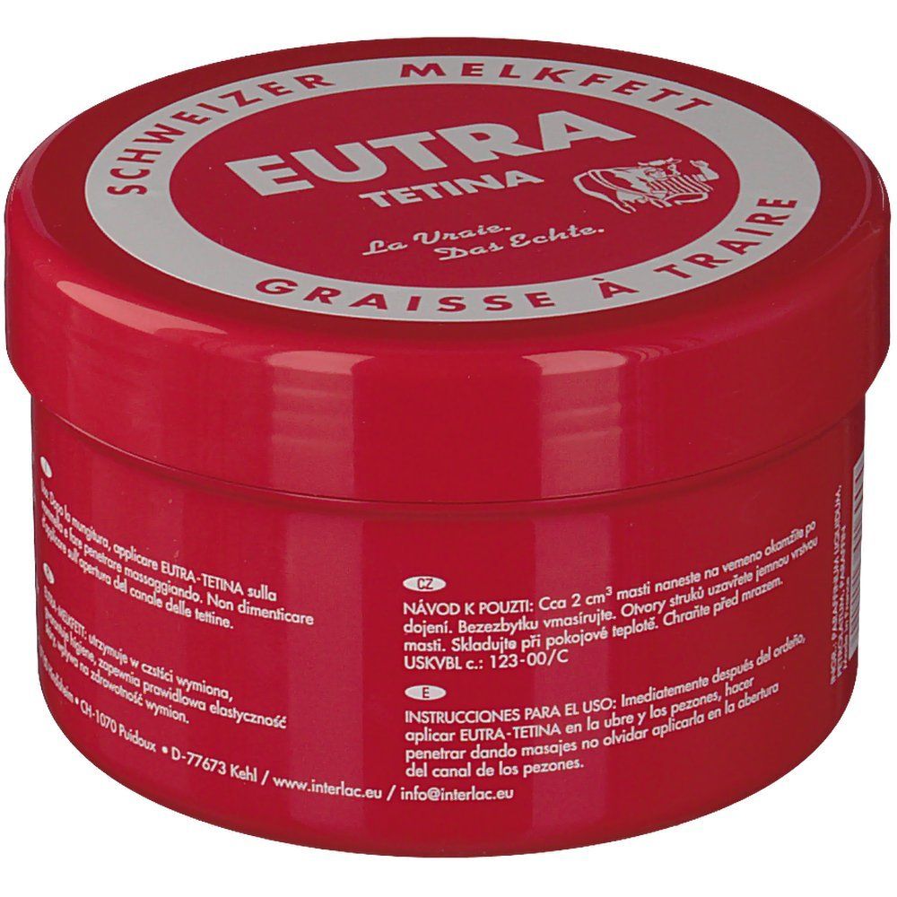 Pot rouge avec couvercle blanc. Inscription: Eutra Tetina, Schweizer Melkfett, Graisse à Traire. Instructions d'utilisation en plusieurs langues.