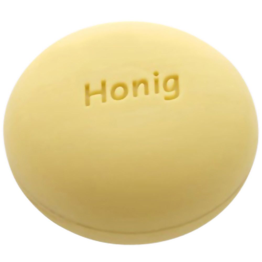 Savon rond et jaunâtre avec l'inscription "Honig".