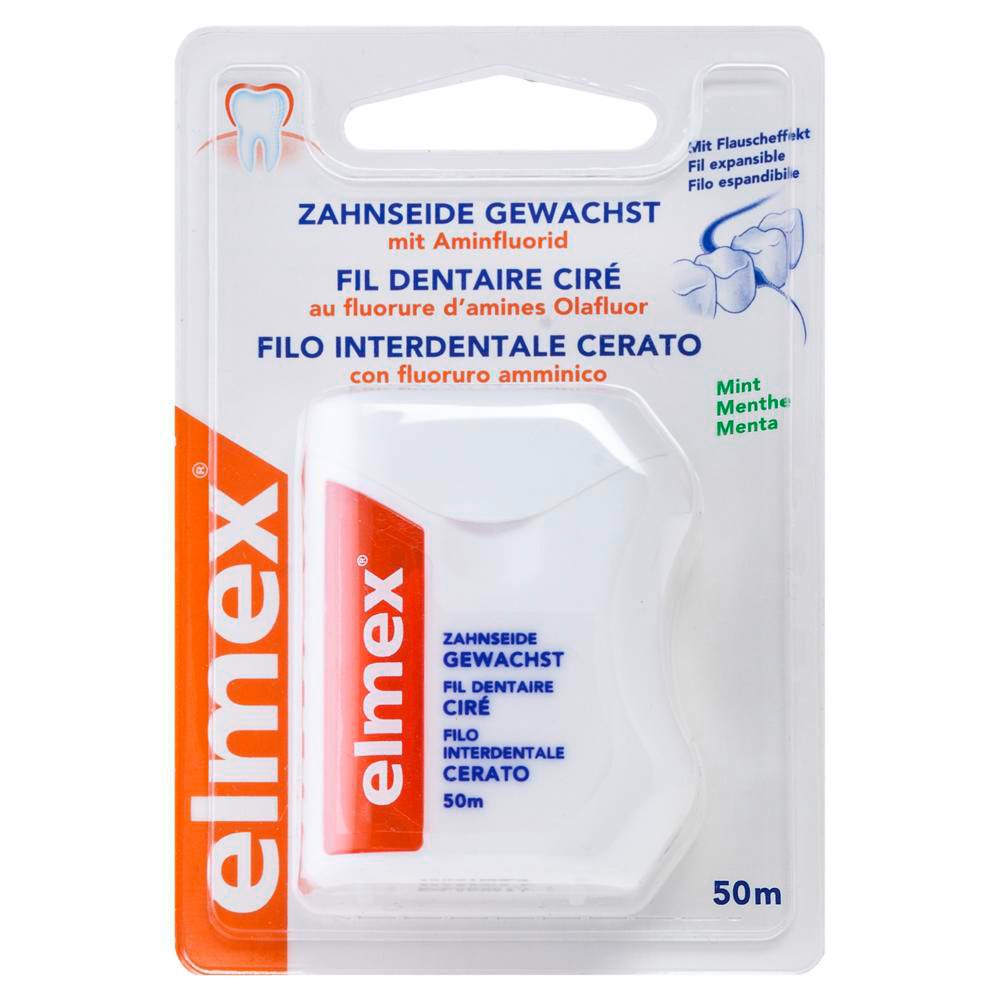 Fil dentaire ciré Elmex dans son emballage. Boîtier blanc avec logo rouge. Informations multilingues.