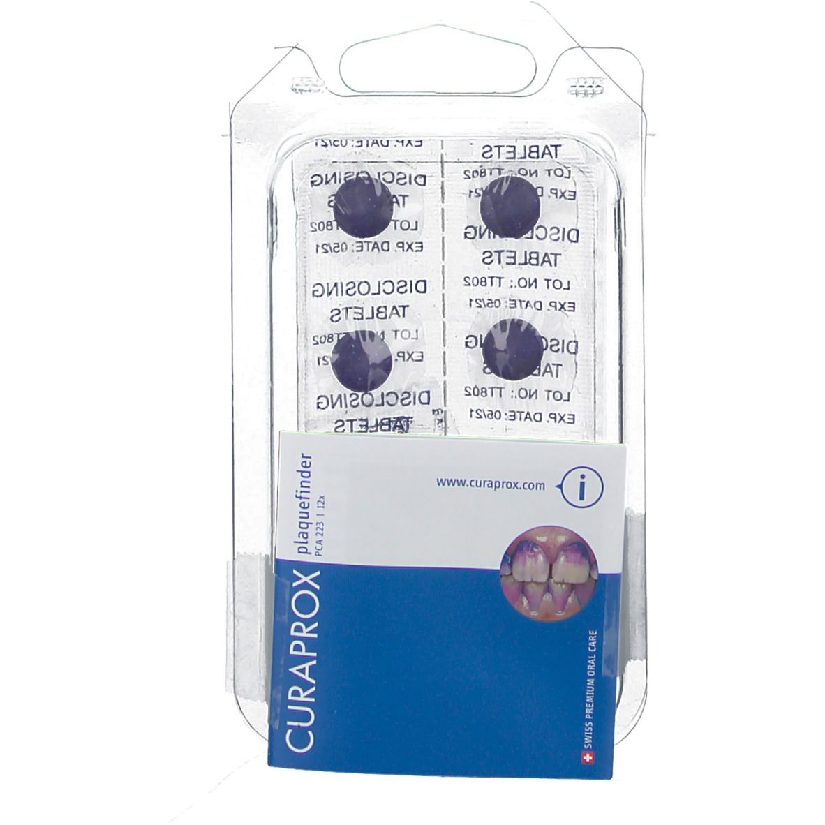 Blister de comprimés. En dessous, une notice avec des informations sur le produit et le nom de la marque CURAPROX.