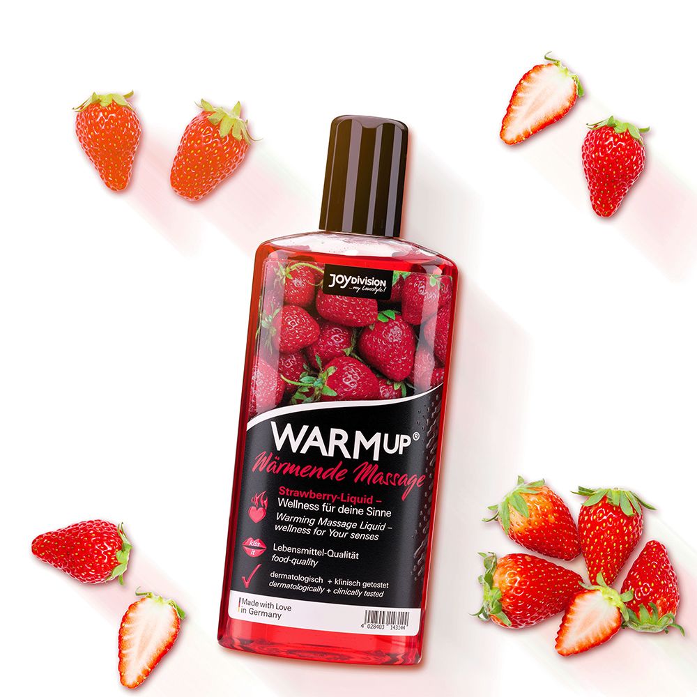 Bouteille de WARMup® Massageliquid entourée de fraises fraîches.