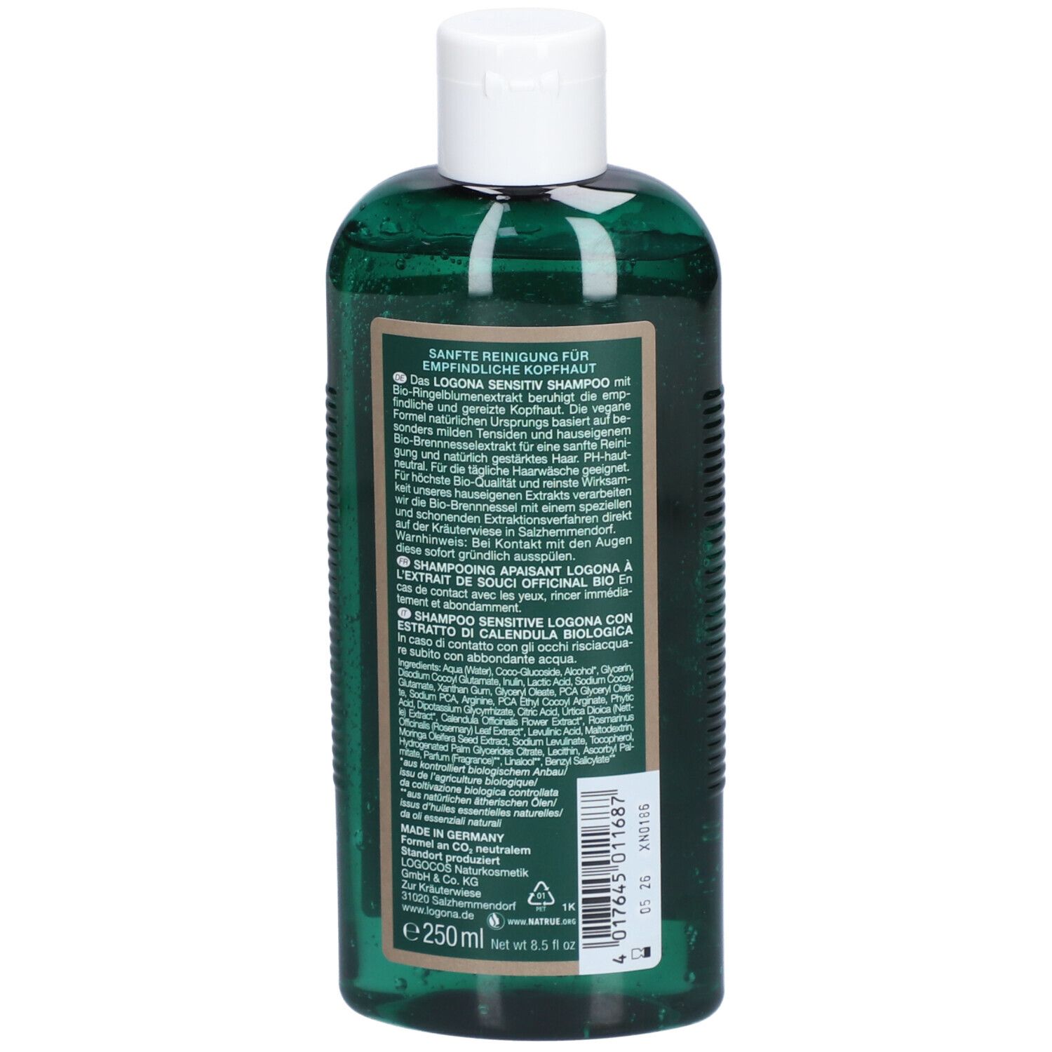 Dos d'un flacon de shampooing vert. Texte en plusieurs langues, dont l'allemand, le français, l'italien. Ingrédients.