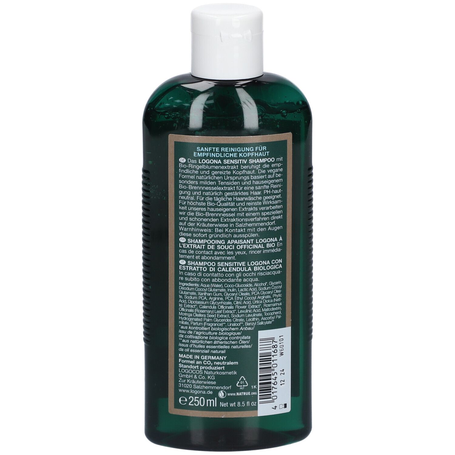 Dos d'un flacon de shampooing vert. Texte en plusieurs langues, dont l'allemand, le français, l'italien. Ingrédients.