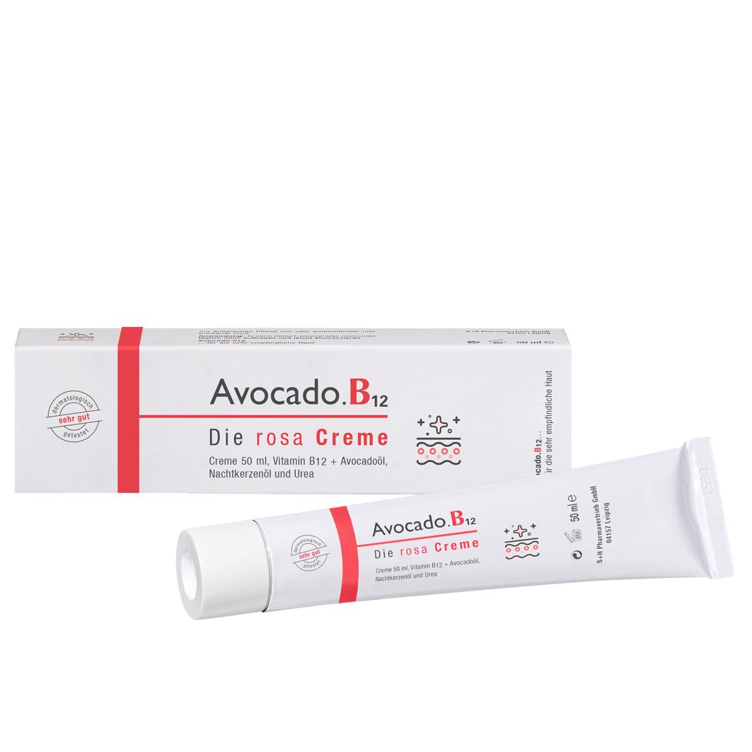 Tube et boîte pliante blanches avec texte rouge. Inscription: Avocado.B12 Die rosa Creme. Contient de la vitamine B12 et de l'huile d'avocat.