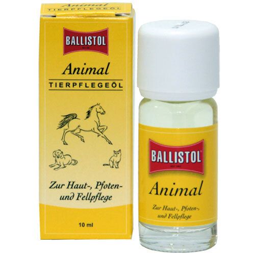 Boîte jaune et flacon à bouchon blanc. Inscription BALLISTOL Animal Tierpflegeöl. Illustration d'animaux.