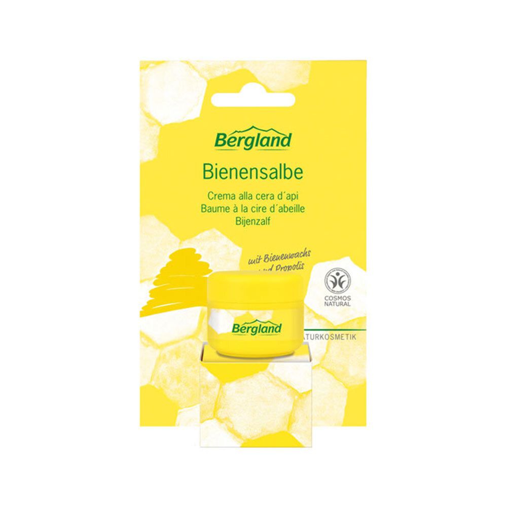 Pot jaune "Bergland Bienensalbe" sur emballage jaune. Label "Cosmos Natural".