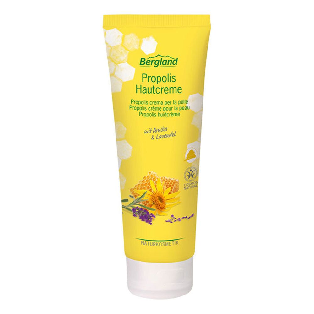 Tube jaune "Bergland Propolis Hautcreme". Illustrations de rayons de miel, arnica et lavande. Cosmétiques naturels.