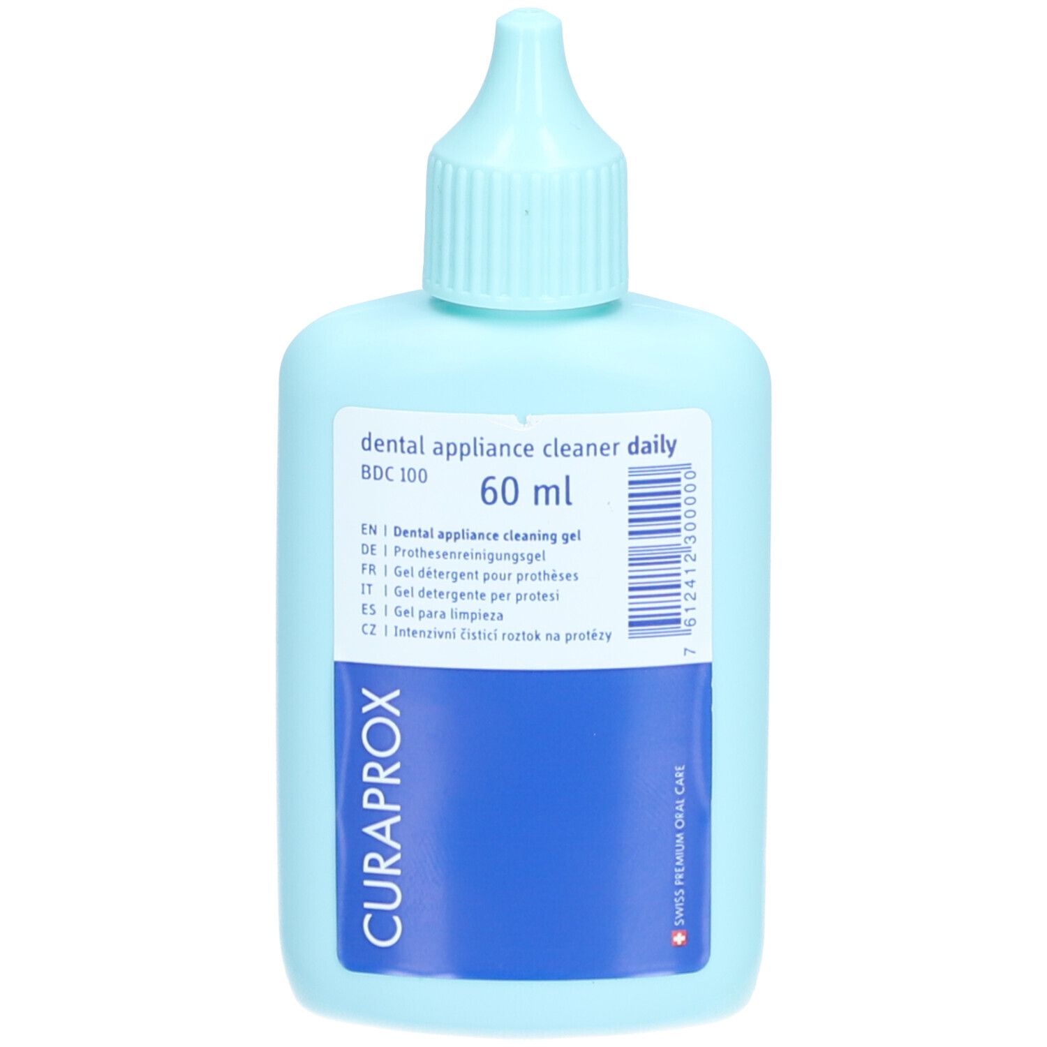Flacon bleu clair avec bouchon doseur. Étiquette avec informations produit et logo "CURAPROX".