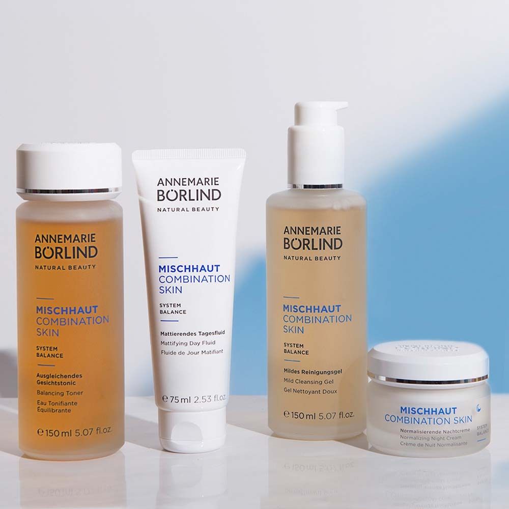Quatre produits : flacon, tube, flacon et pot. Inscription : ANNEMARIE BÖRLIND, MISCHHAUT COMBINATION SKIN.