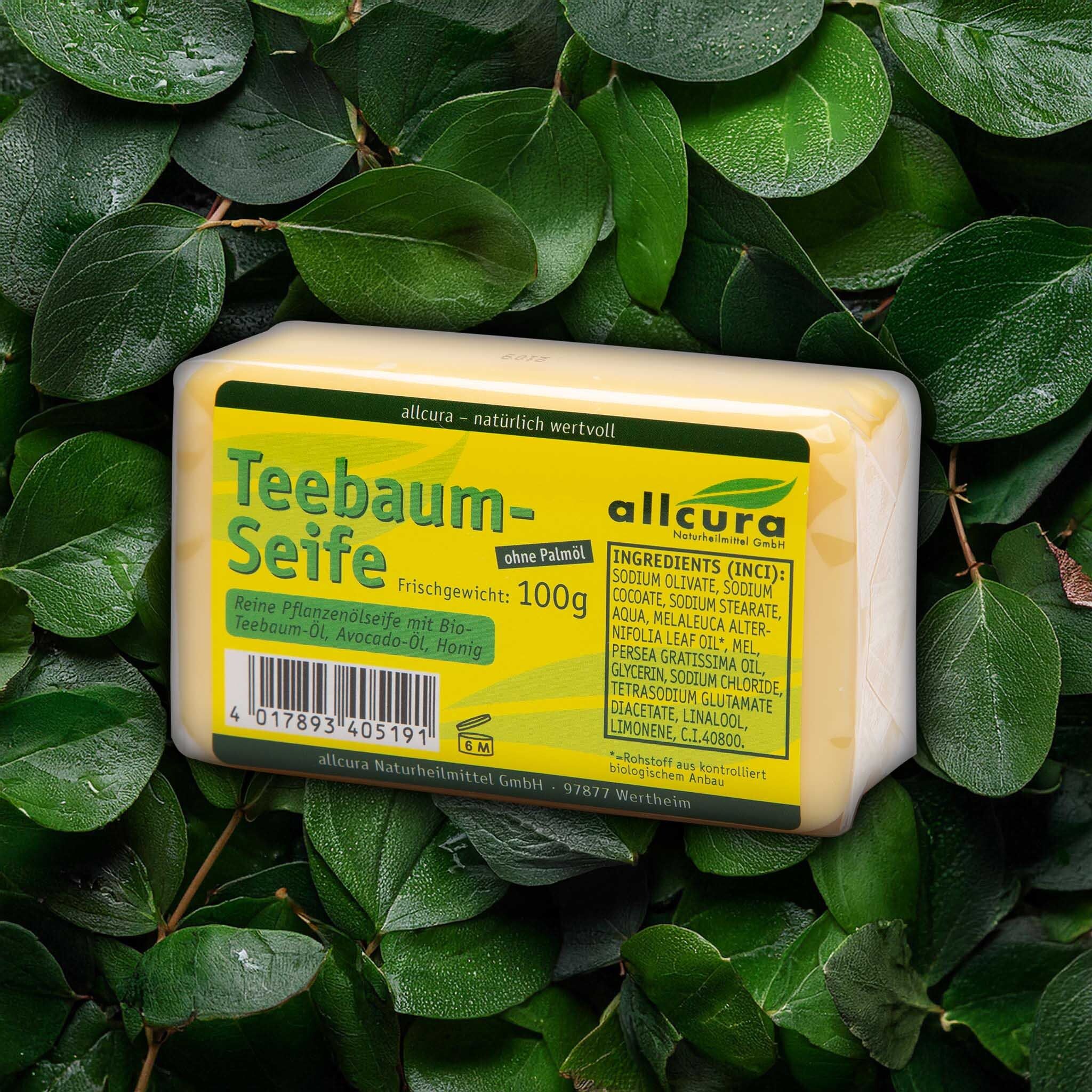 Savon jaune sur feuilles. Inscription: Teebaum-Seife, allcura. Poids 100g. Ingrédients.