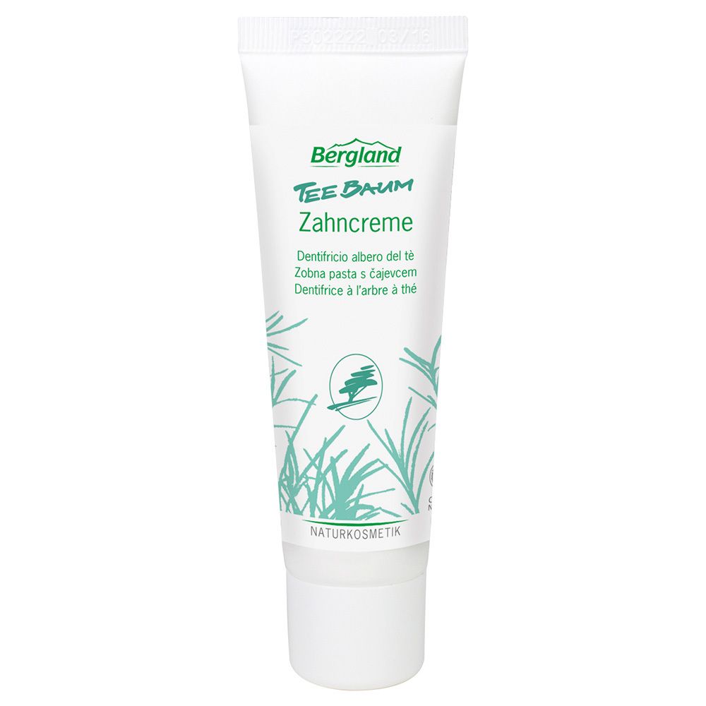 Tube de dentifrice avec logo vert et texte. Inscription : Bergland Teebaum Zahncreme. Naturkosmetik.
