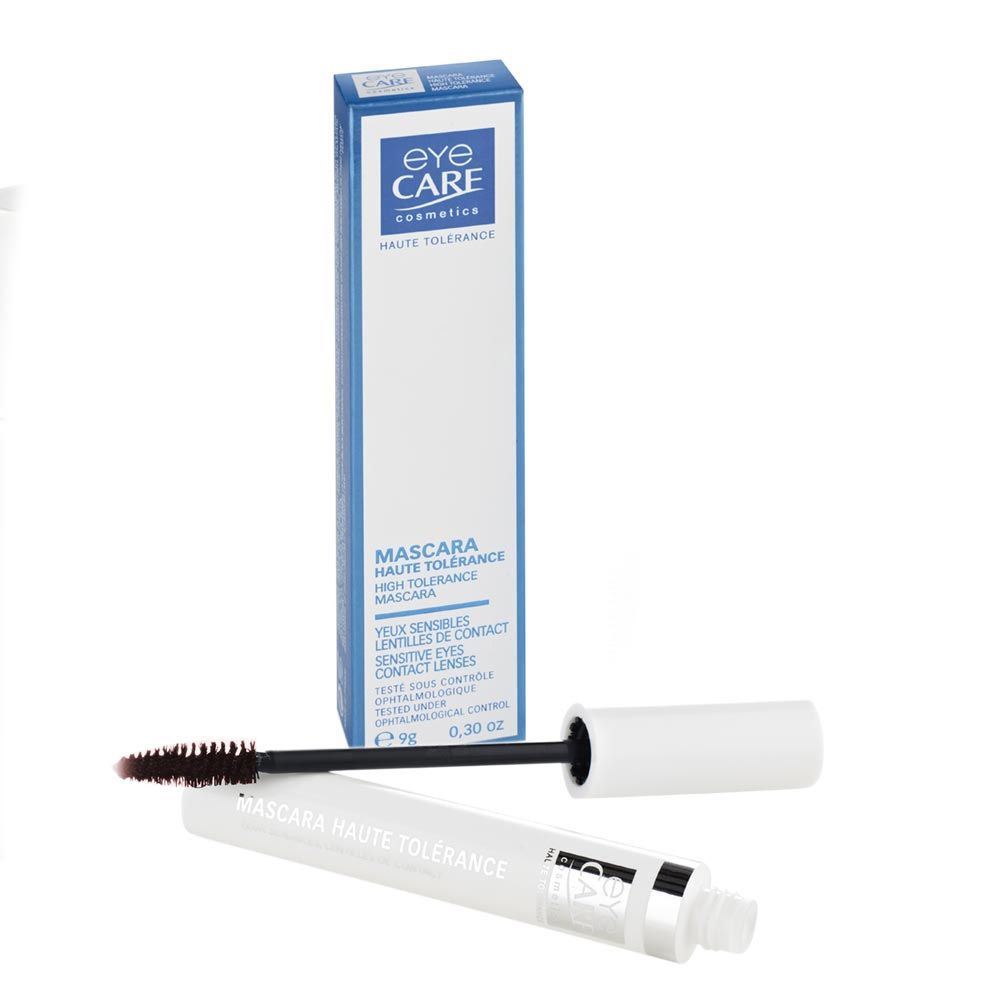 Mascara et emballage. Boîte bleue avec texte blanc. Tube de mascara à côté.