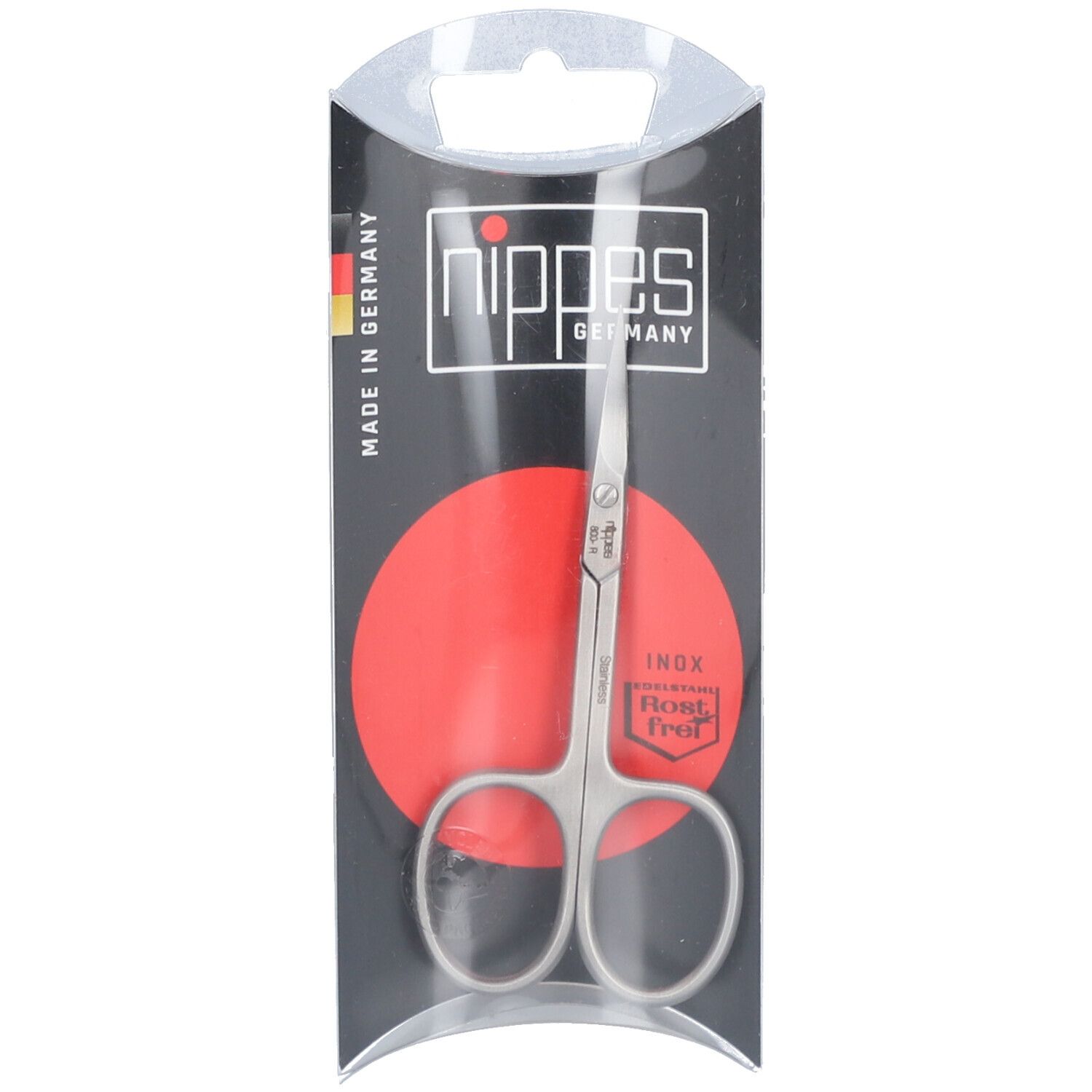 Ciseaux à peau inoxydables dans leur emballage. Marque Nippes, Fabriqué en Allemagne. Cercle rouge. Inox, résistant à la rouille.