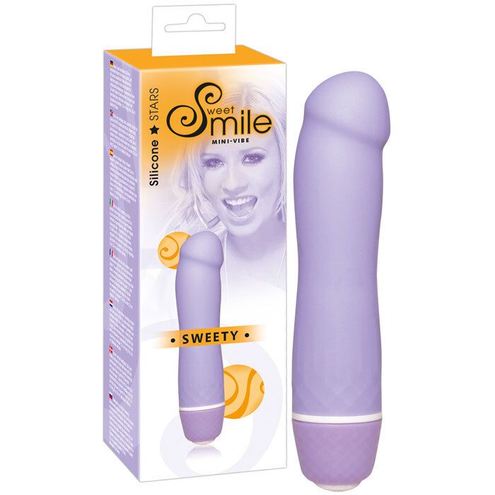 Vibrateur violet et son emballage. L'emballage indique "Sweet Smile Mini-Vibe Sweety".