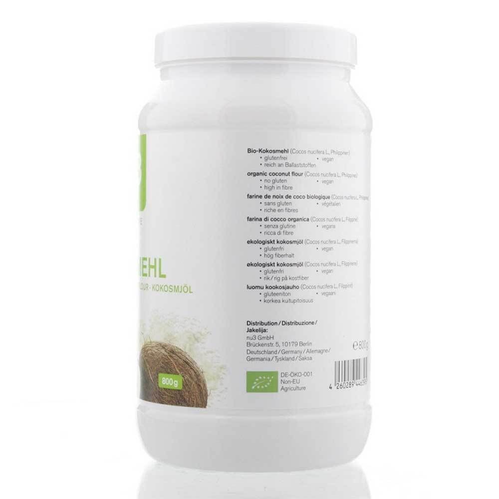 Pot blanc avec texte et label bio. Inscription : Farine de coco bio, ingrédients, informations fabricant.