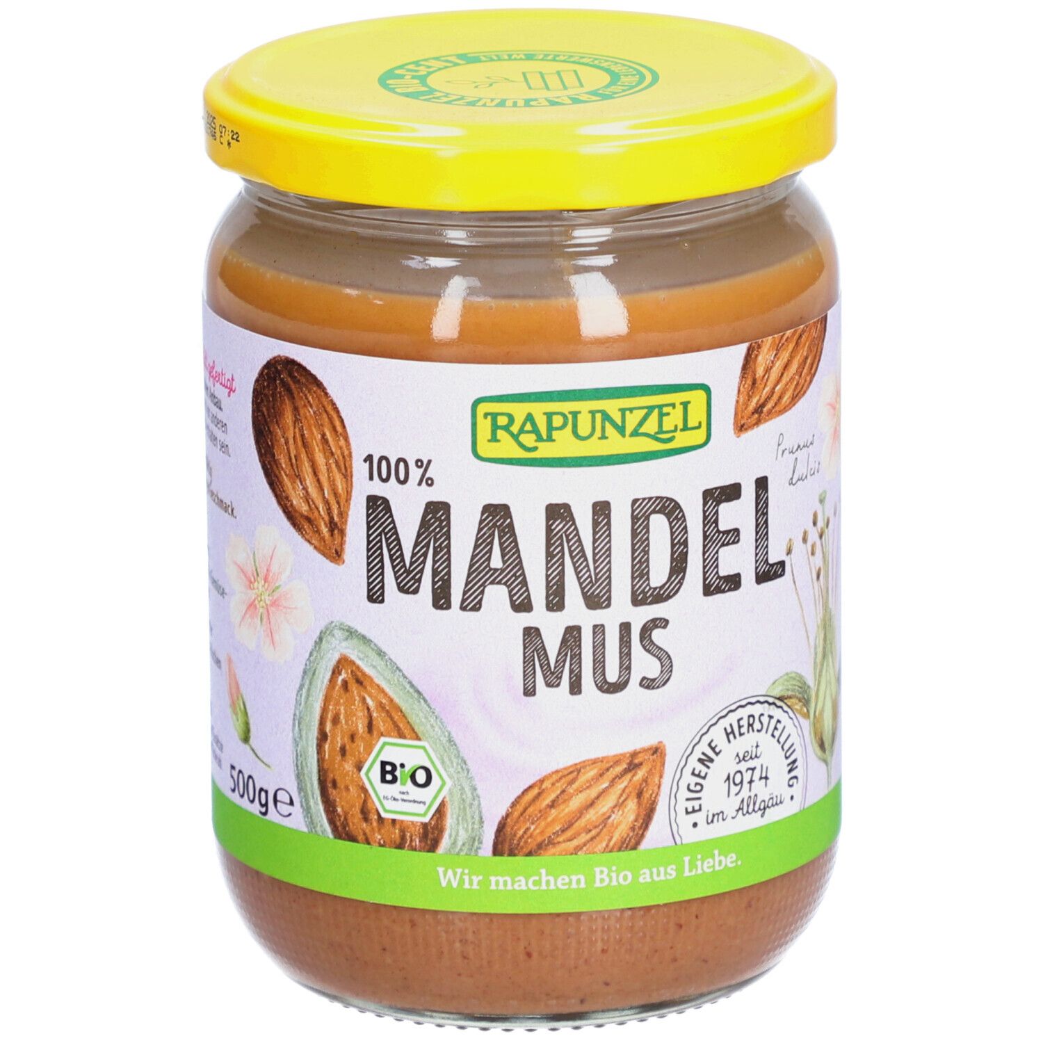 Pot de beurre d'amandes. Couvercle jaune, étiquette avec 'Mandelmus' et 'Bio'.