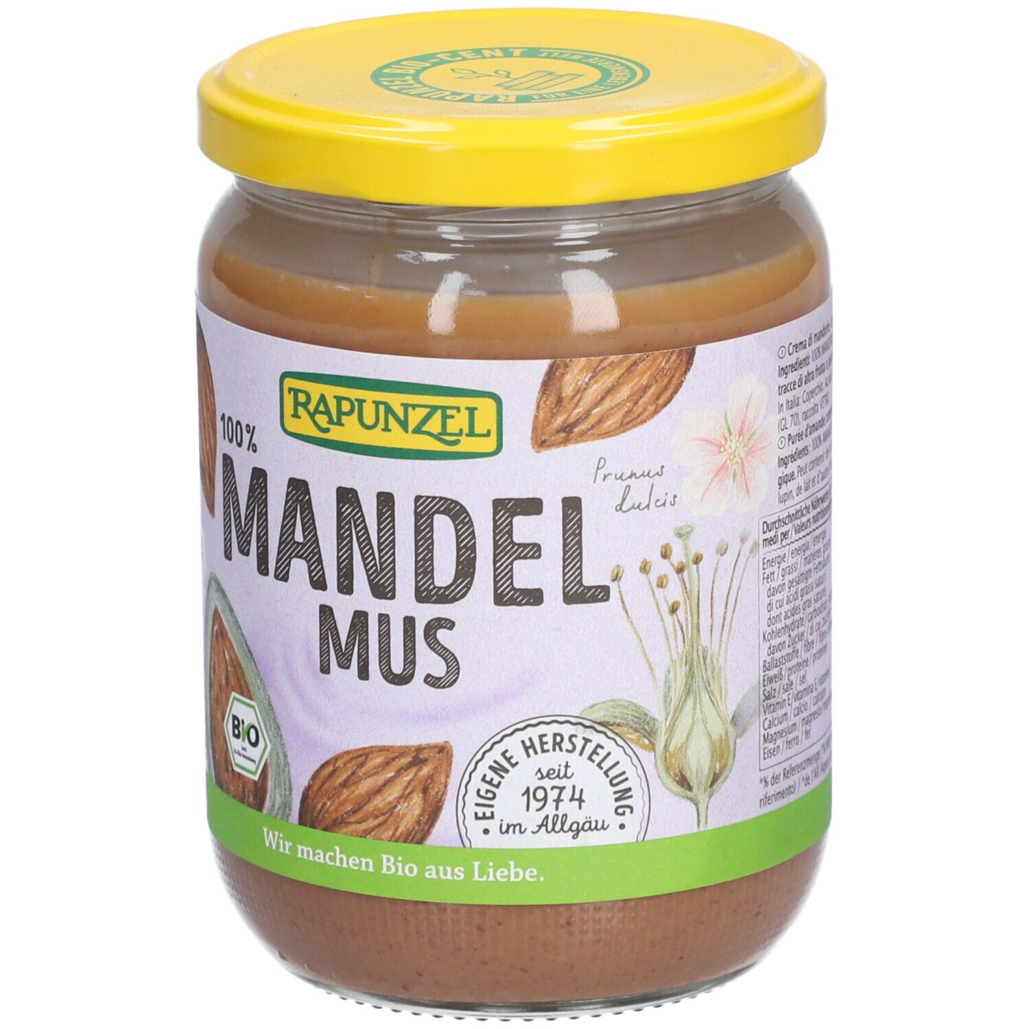 Pot de beurre d'amandes. Couvercle jaune, étiquette avec 'Mandelmus' et 'Bio'.