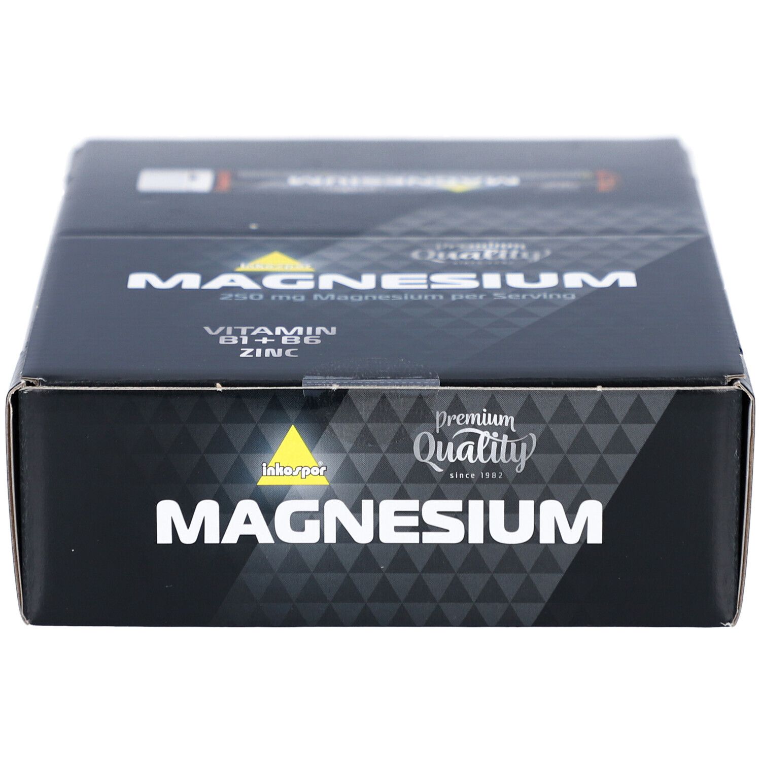 Boîte noire avec "MAGNESIUM". Contient "Vitamine B1+B6, Zinc". Logo "Premium Quality".