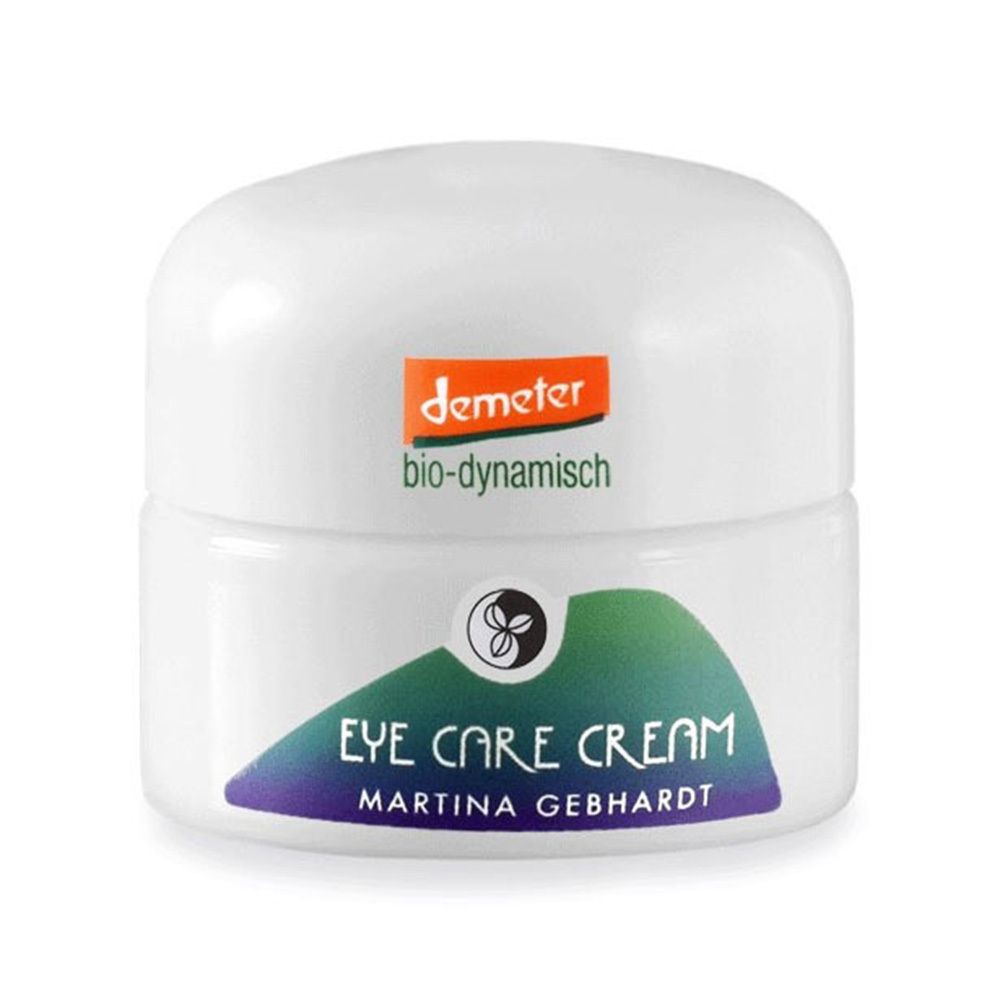 Pot de crème blanc avec couvercle. Inscription : Eye Care Cream, Martina Gebhardt. Logo Demeter. Bande verte et bleue.