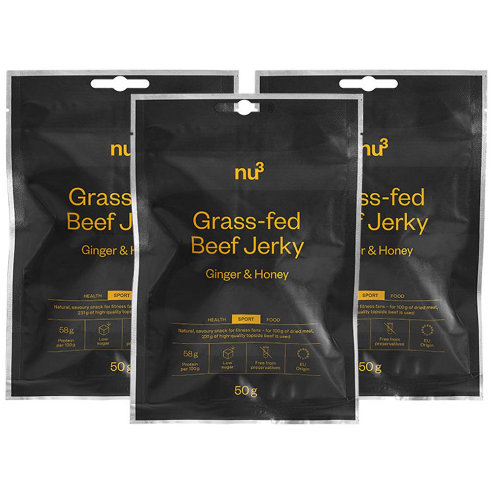Trois sachets de Beef Jerky, gingembre et miel, avec logo et nom du produit. Emballage noir avec texte jaune.