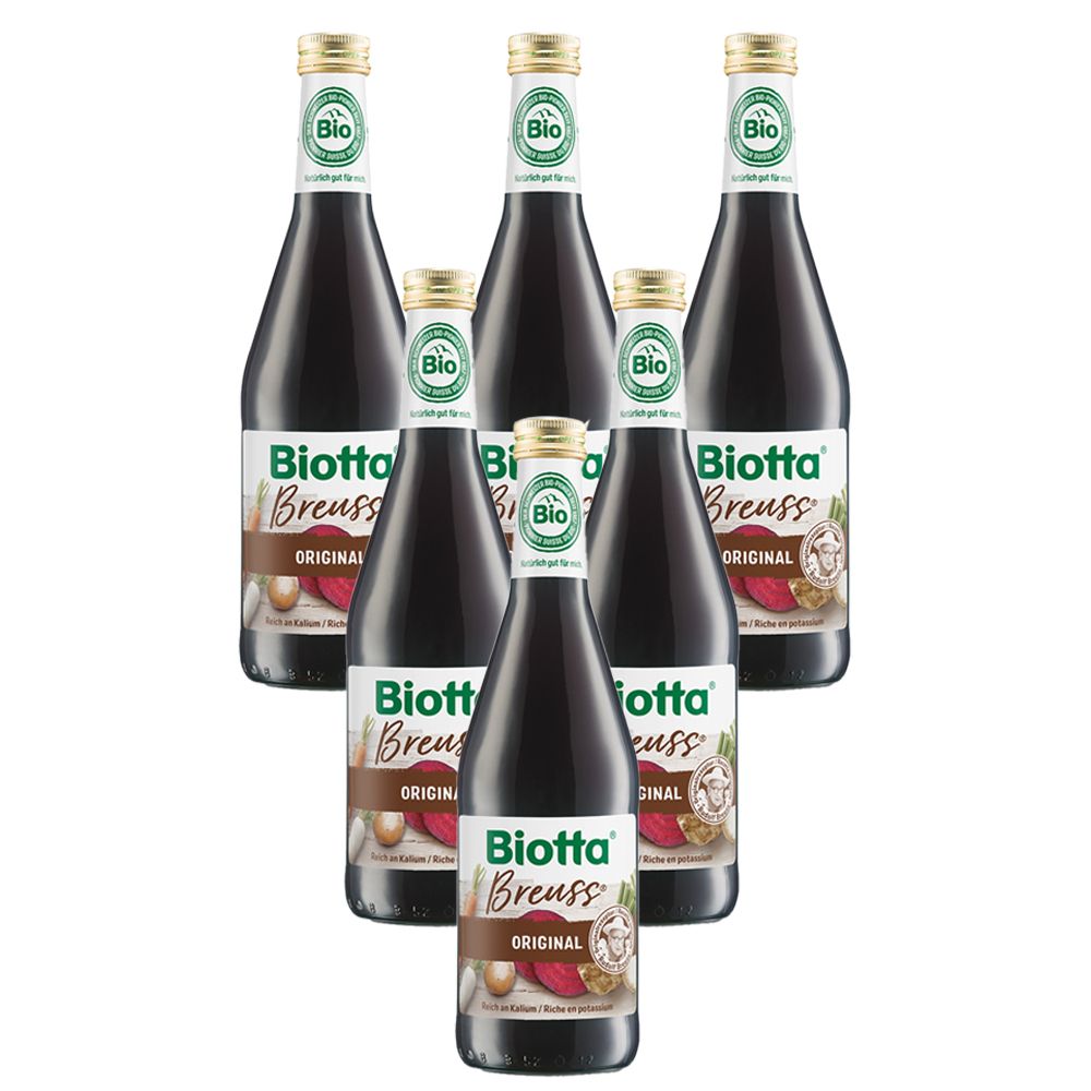 Six bouteilles de Biotta Breuss Original. Bouteilles en verre foncé avec étiquette blanche et label bio.