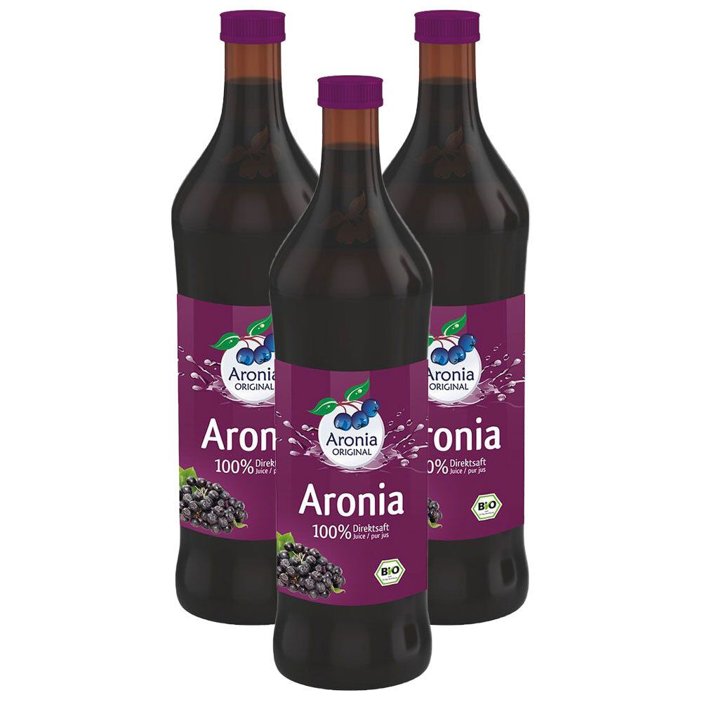 Trois bouteilles de jus d'aronia bio. Étiquettes violettes avec nom du produit et label bio. Liquide violet foncé.