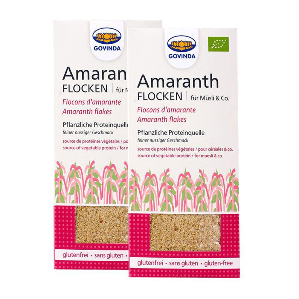 Deux paquets de flocons d'amarante. Inscriptions: GOVINDA, Amaranth, sans gluten, label bio. Produit visible dans un film transparent.