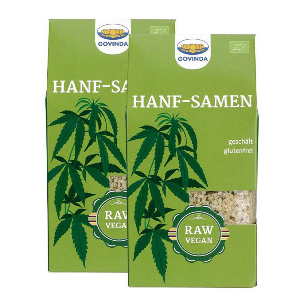 Deux paquets verts de graines de chanvre. Inscription : HANF-SAMEN, RAW VEGAN, sans gluten. Marque : GOVINDA. Illustration de feuilles de chanvre.