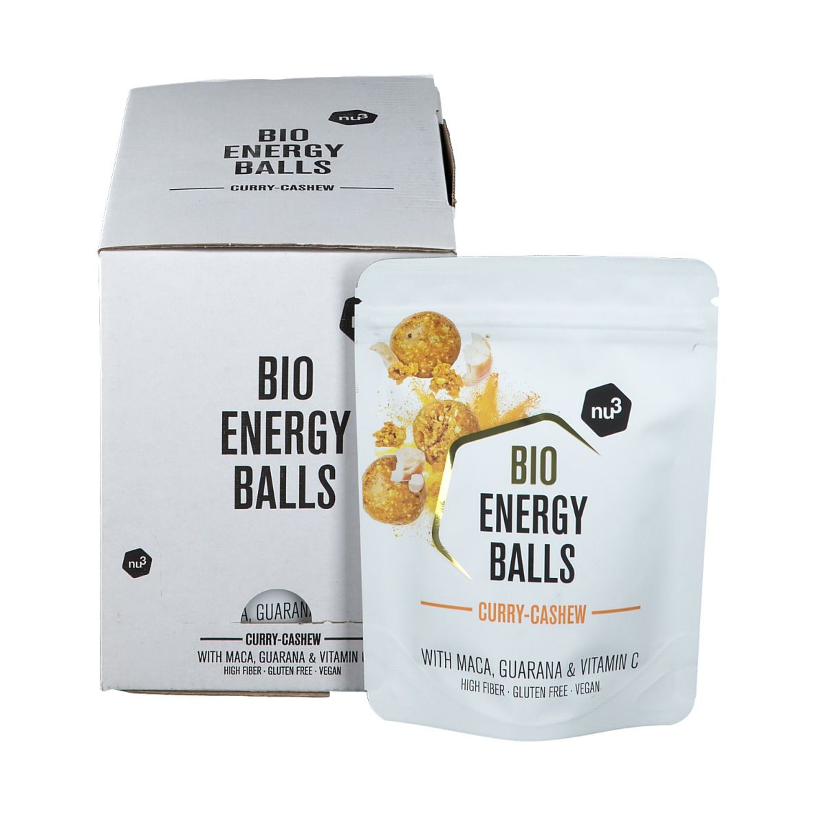 Emballage en carton blanc et sachet avec l'inscription "BIO ENERGY BALLS Curry-Cashew". Le sachet montre une image du produit et des ingrédients.