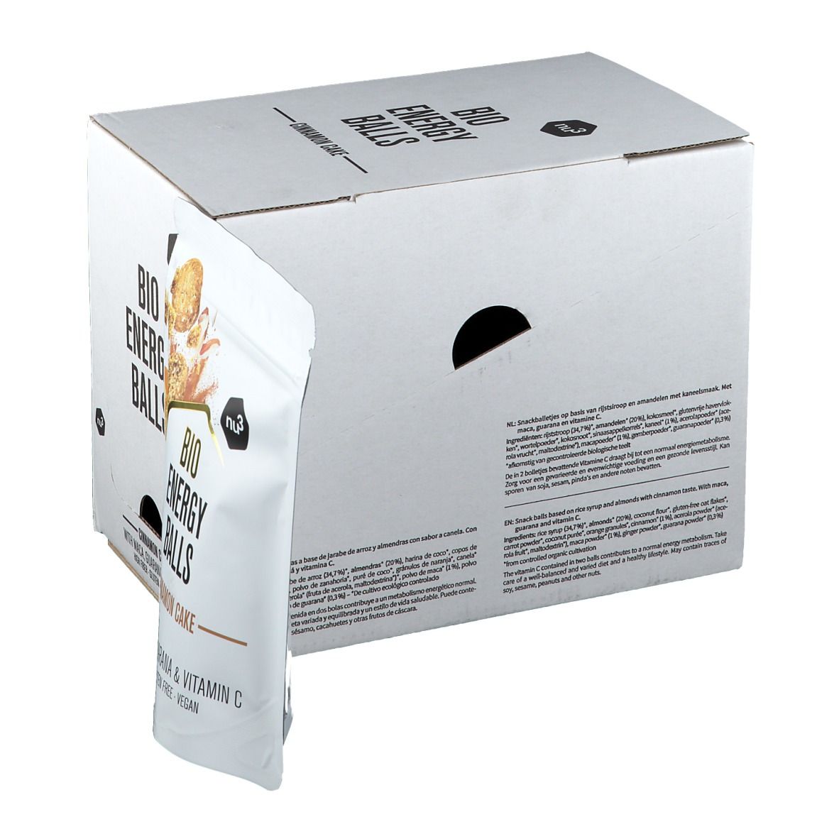 Emballage en carton blanc avec l'inscription "BIO ENERGY BALLS". Un sachet avec l'inscription "Cinnamon Cake" dépasse. Inscriptions en anglais et en allemand.